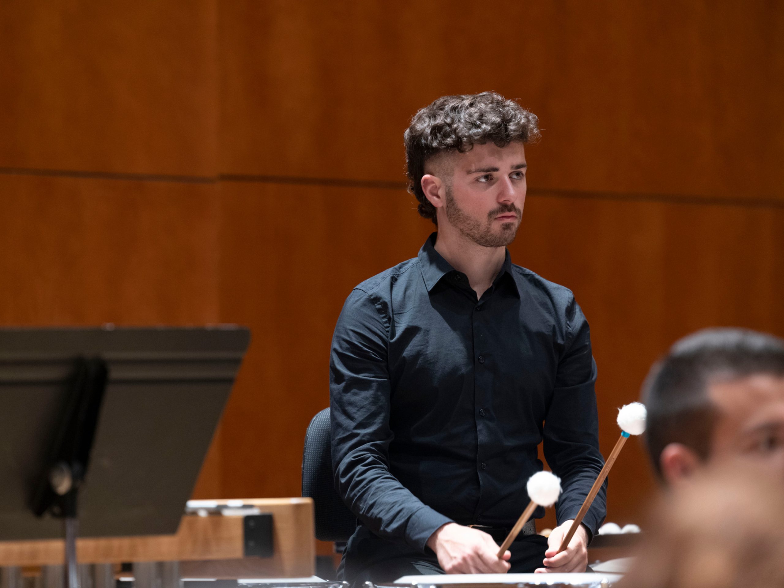 Oier playing timpani in the orchestra